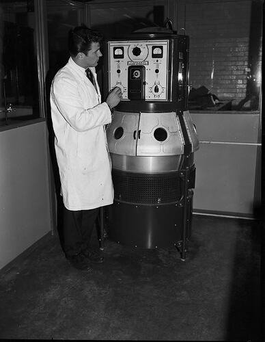Monochrome photograph of a hoisery factory.