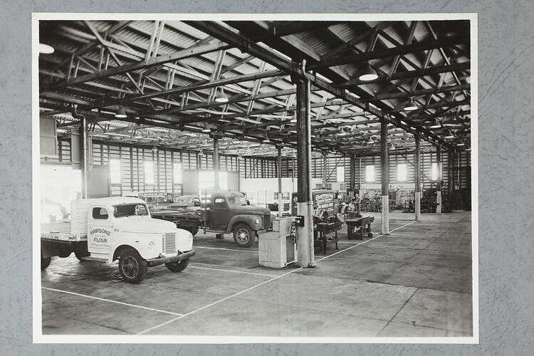 Monochrome photograph of a workshop interior.