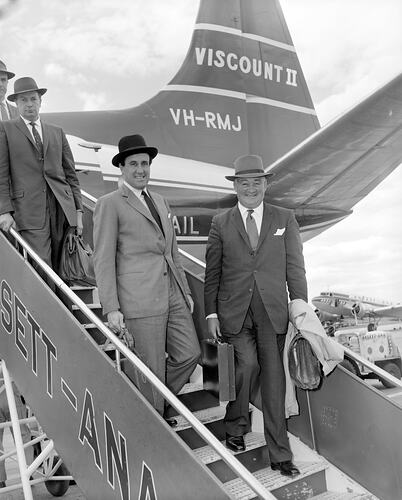 H.J. Heinz Company, Group of Men Disembarking Aeroplane, Essendon Airport, Victoria, 09 Dec 1959