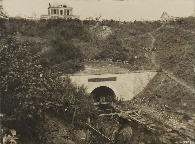 Railway tunnel with soldiers.