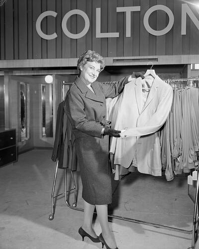 Woman Holding a Suit Jacket, Coltons General Drapery Store, Toorak, Victoria, 07 Mar 1960