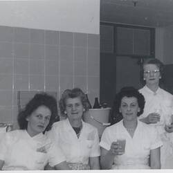 Four women in canteen uniforms.