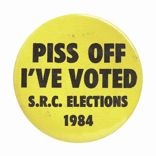 Round yellow badge, black text.