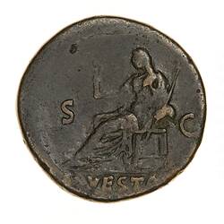 Round coin, aged, seated figure , facing left, left hand holding out small statue, right hand holding spear.