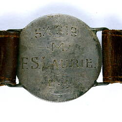 Detail of florin back on identity bracelet.