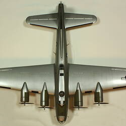 Silver model aeroplane. View from above.