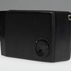 Side view of black plastic movie camera.