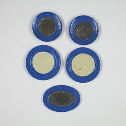 Front side five toy plates.
