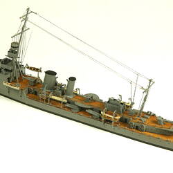 Naval ship with mast, three quarter view.