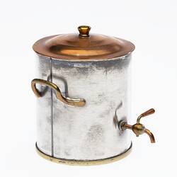 Miniature coffee urn made from silver and copper. Brass handle on side, Copper lid with knob and tap at front.