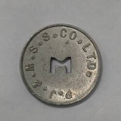 Round coin with M cut out of centre.