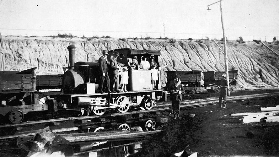 Family group posing for a photograph on a locomotive, Gippsland, circa 1925.