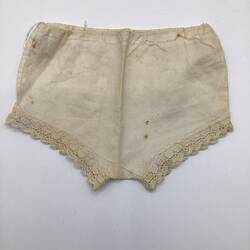 White doll's underwear with lace trim.