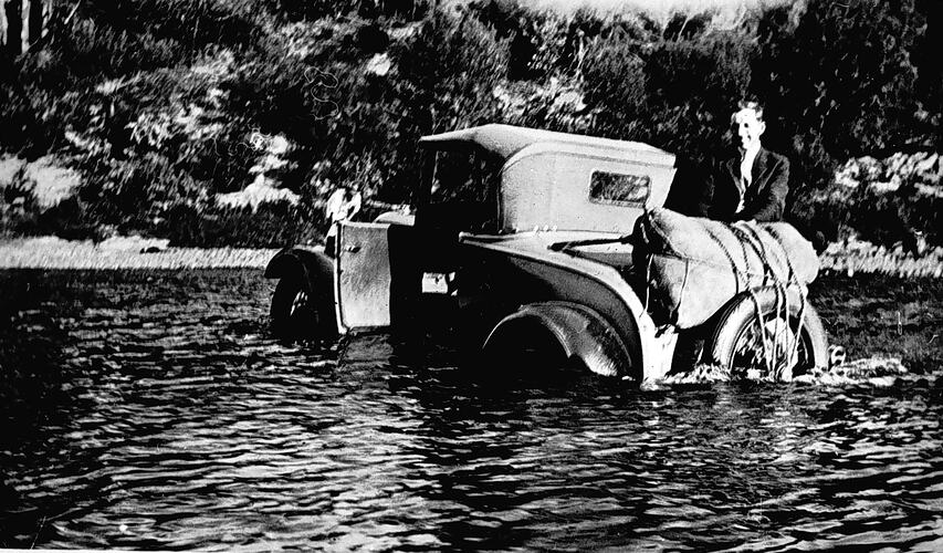 [A car that has stalled while fording the Tambo River, about 1935.]
