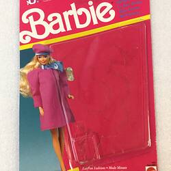 Pink card packaging for Barbie doll.