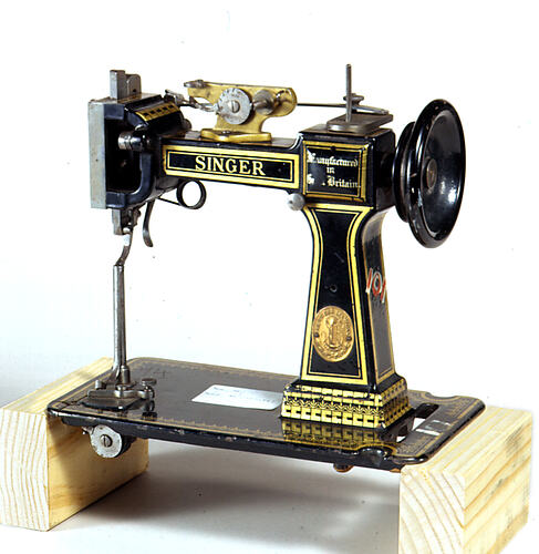 Black and gold old fashioned Singer sewing machine.