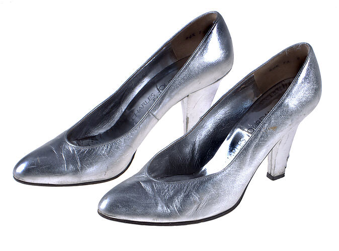 Two heeled silver shoes