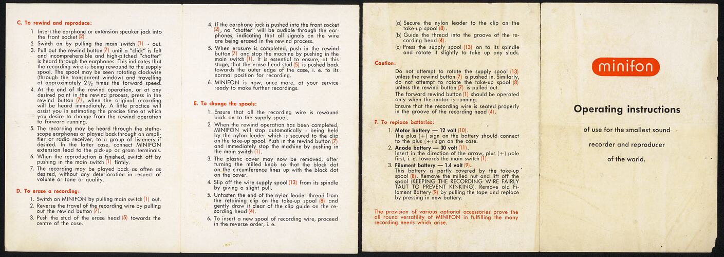 Two open white pages side by side with printed text in black and red.