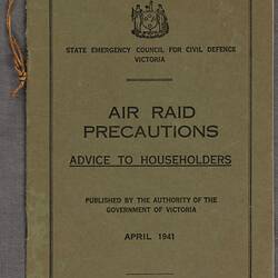 Front green cover of pamphlet. Black printed text.
