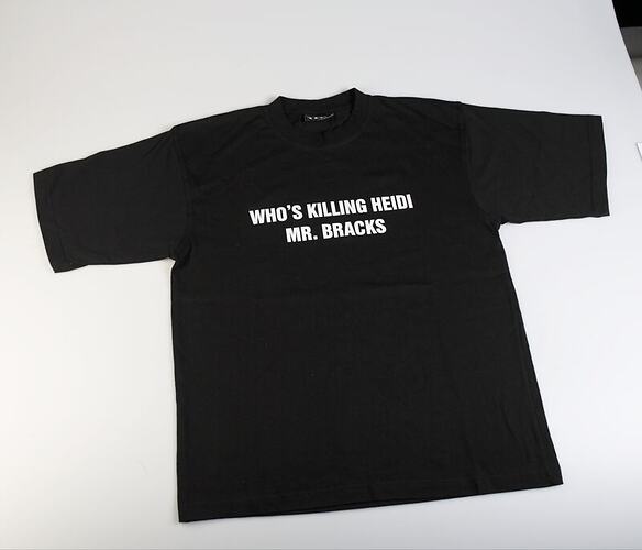 Black t-shirt with white lettering.