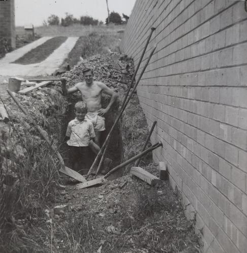 Digital Photograph - Man & Boy Digging Hole for Septic Tank, House Building Site, Greensborough, circa 1959