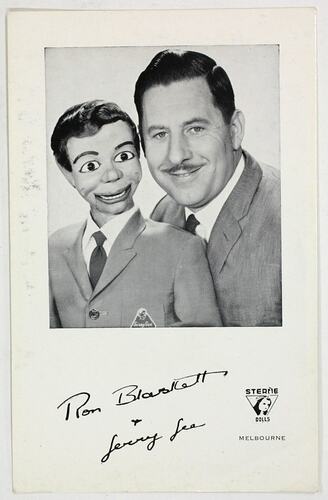 Signed card with a picture of a man and a ventriloquist doll.