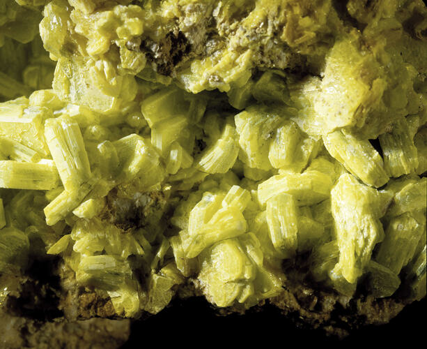Bright yellow mineral surface.