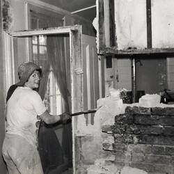 Woman Demolishing Interior Wall in Kitchen, Fitzroy, 1976