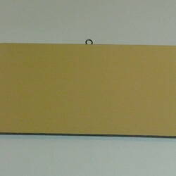 Painted board showing sample of apricot colour.