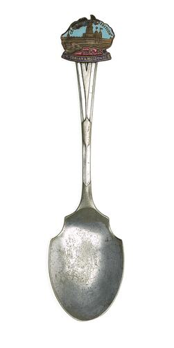 Silver spoon with blue and red enamel badge in the shape of Australia.
