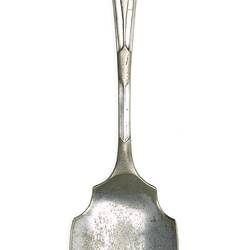 Silver spoon with blue and red enamel badge in the shape of Australia.