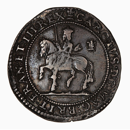 Coin, round, within a circle of beads; crowned king wears long scarf and holds sword upright.