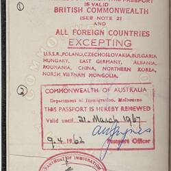 White passport page with red printed text. Blue and black handwritten text.