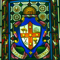 Stained glass window, detail showing an coat of arms.