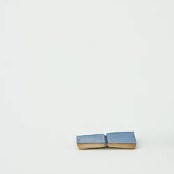 Small book with white pages and a blue cover