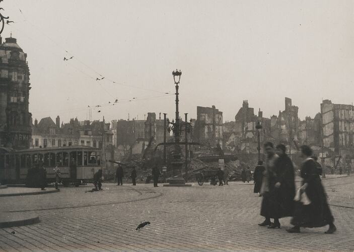 Scene of a city that has been bombed with most of the buildings reduced to rubble.