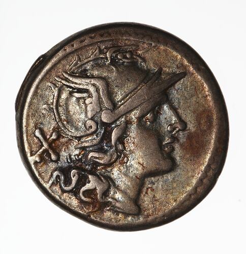 Round coin, aged, female helmeted profile, facing right.