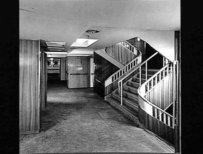 Ship interior. Walkway area with staircase at right.
