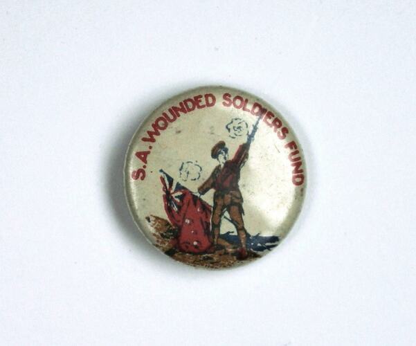 Badge with soldier holding flag, raising gun.