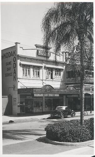 Street view of Kodak building and traffic island.