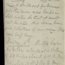 Open diary with handwritten text on discoloured worn page.