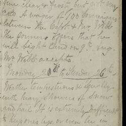 Open diary with handwritten text on discoloured worn page.