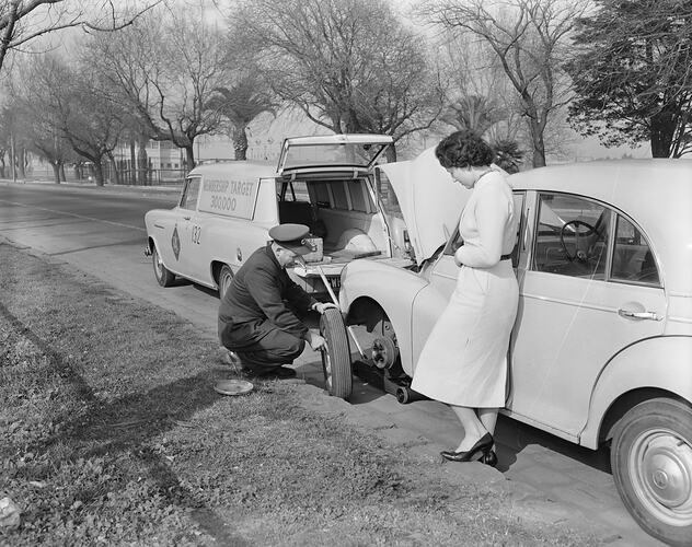 Royal Automobile Club of Victoria, Man Changing a Car Tyre, Albert Park, Victoria, 21 Jul 1959
