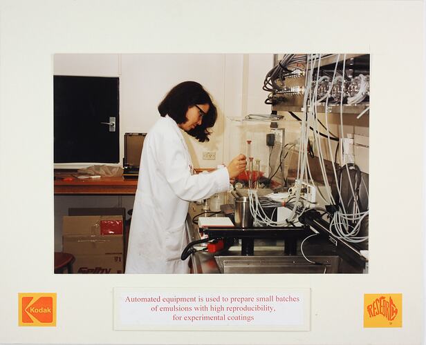 Woman in laboratory measuring liquids.