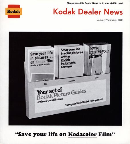 Magazine cover featuring a photo of Kodak brochures.