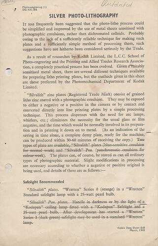 Printed page with handwritten text.