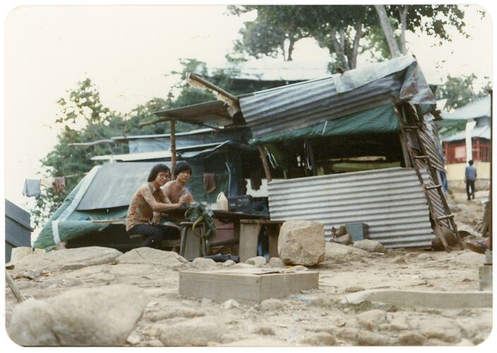 Refugees Seated Outside Housing, Refugee Camp, Pulau Bidong, Malaysia, Apr 1981