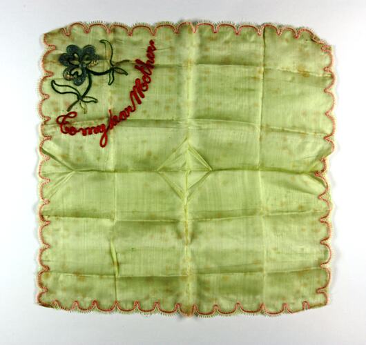 Front of handkerchief with corner embroidery.