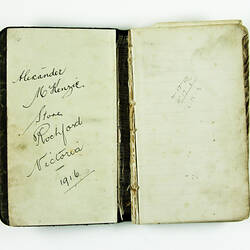 Inside pages, hand-written, of black book.