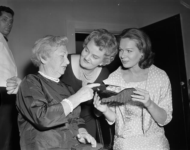 Three Women Looking at a Sandal, Melbourne, 09 Mar 1960
